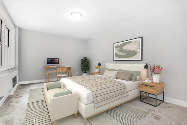 a bedroom with a bed and a couch