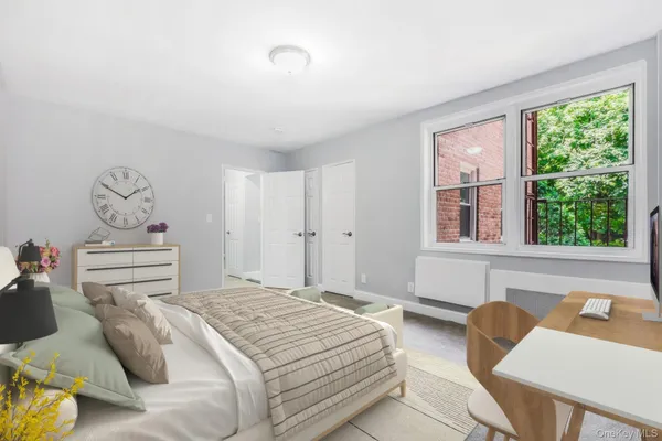 a bedroom with a bed and window