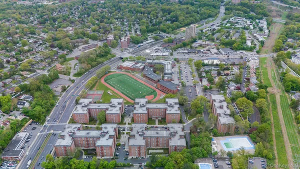 an aerial view of multiple houses with outdoor space