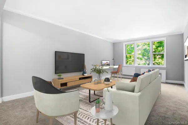 a living room with furniture and a flat screen tv