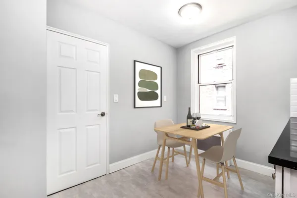 a dining room with furniture and window