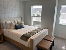 12 South Moonlit Road Mapleton, UT 84664 - Photo 10 of 14 Carpeted bedroom featuring wallpapered walls and an accent wall