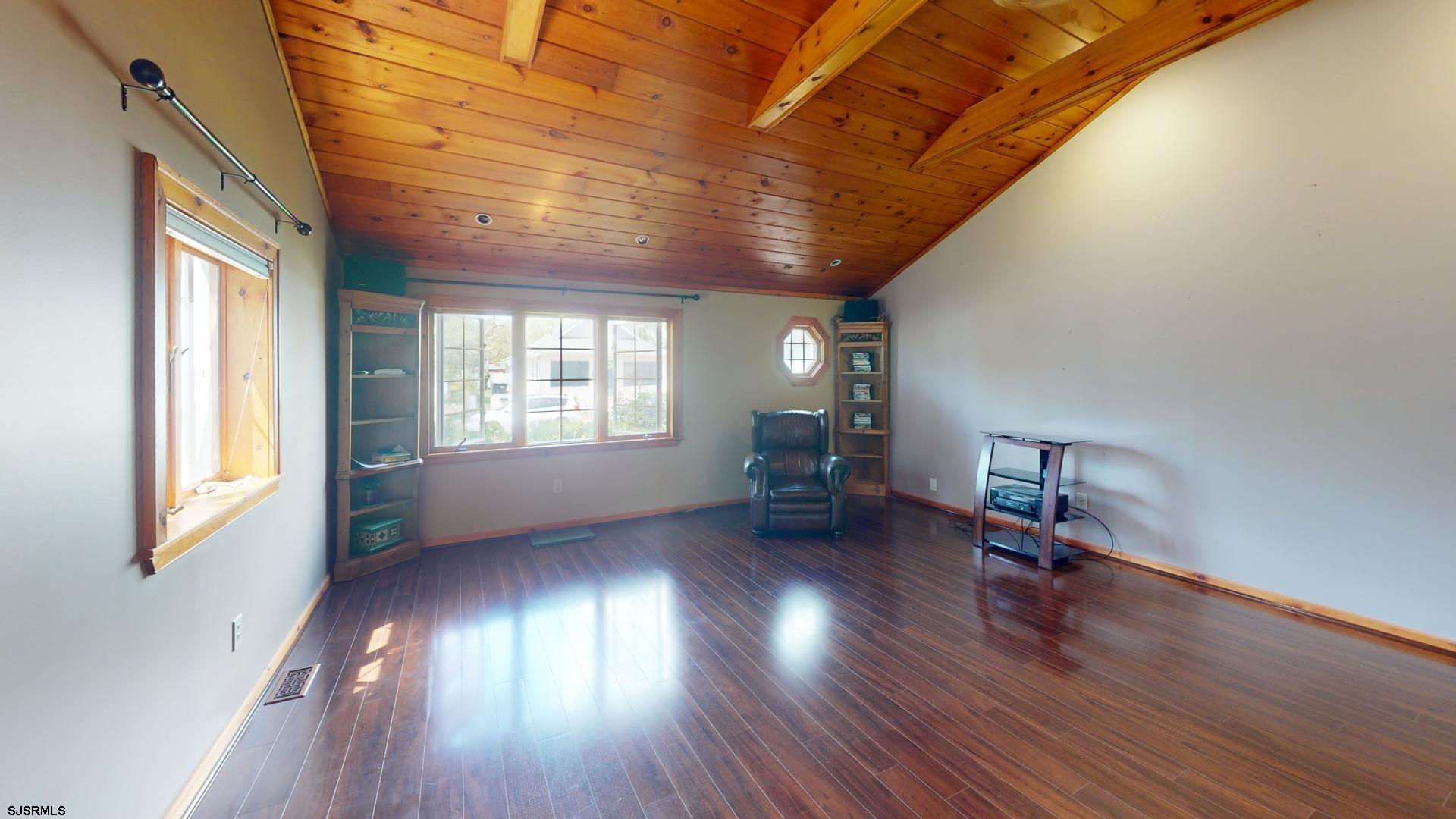 228 Marlin Road Absecon, NJ 08201 - Photo 11 of 24 a view of empty room with wooden floor and fan