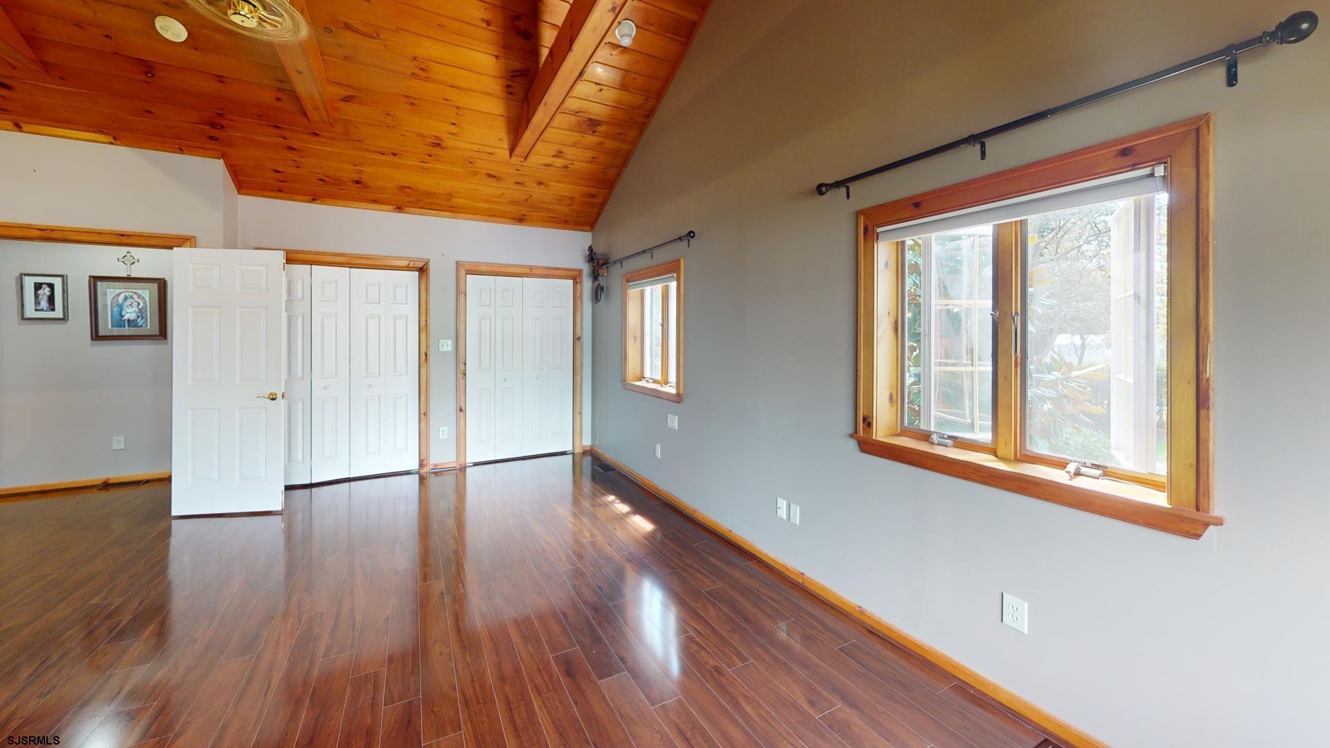 228 Marlin Road Absecon, NJ 08201 - Photo 12 of 24 a view of empty room with wooden floor and fan