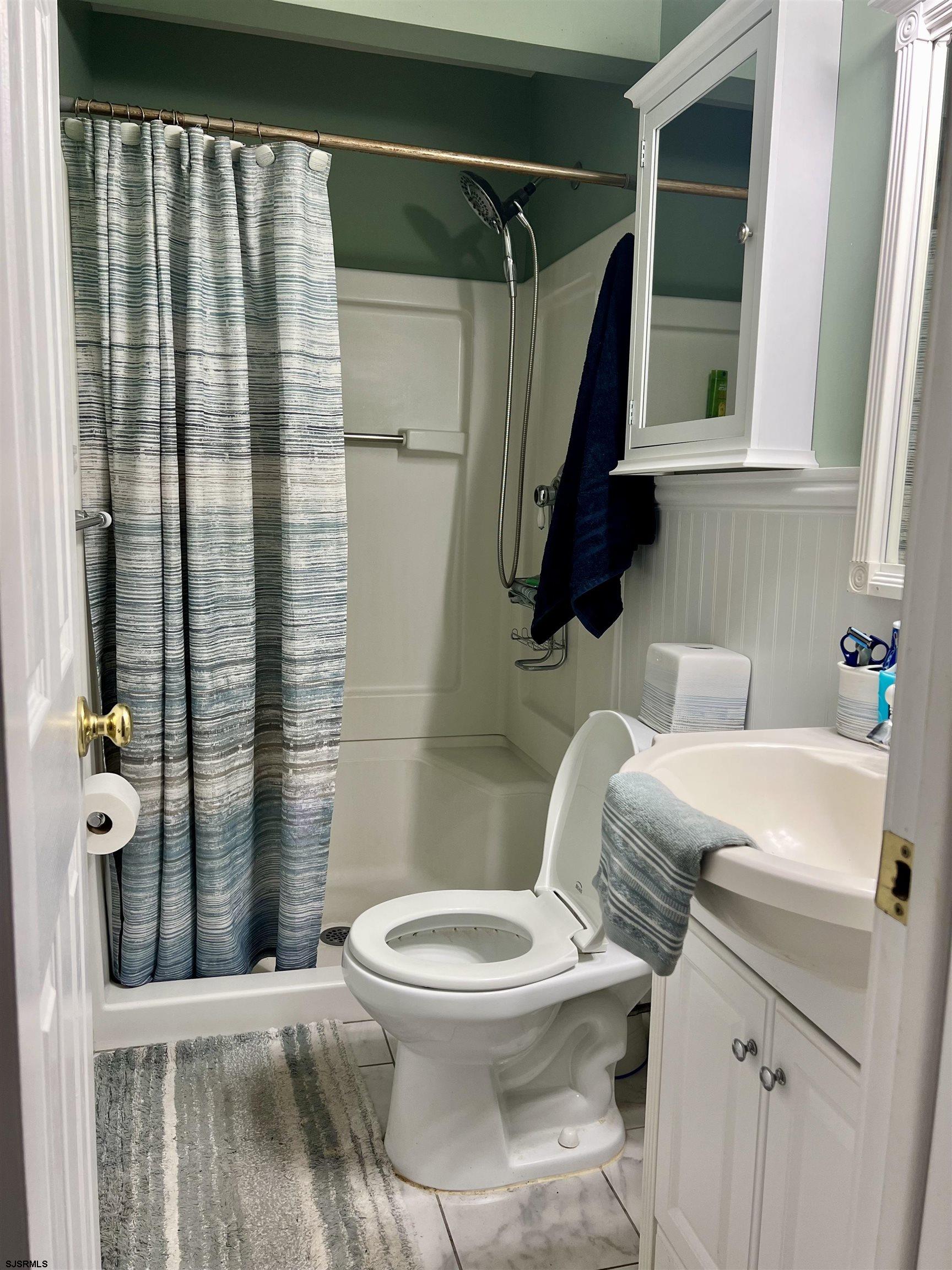 228 Marlin Road Absecon, NJ 08201 - Photo 17 of 24 a bathroom with a toilet and a shower