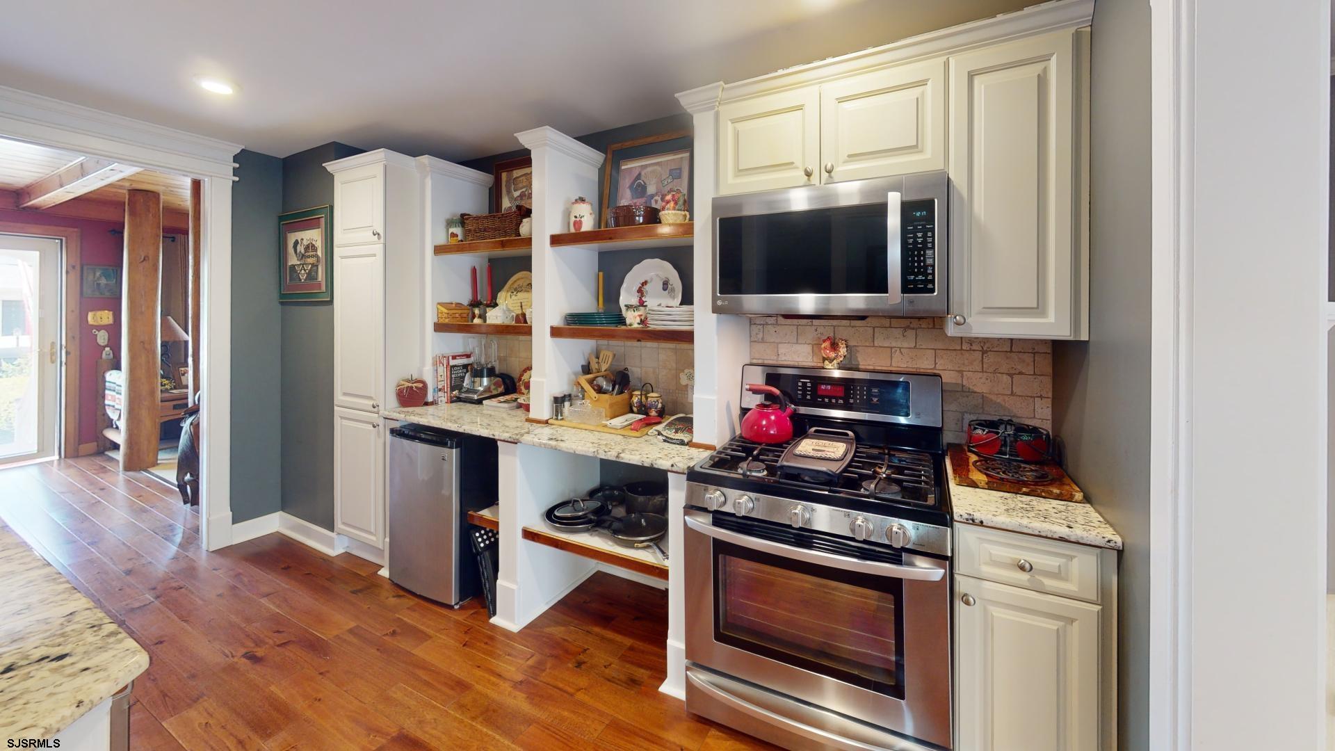 228 Marlin Road Absecon, NJ 08201 - Photo 5 of 24 a kitchen with stainless steel appliances a stove microwave and refrigerator