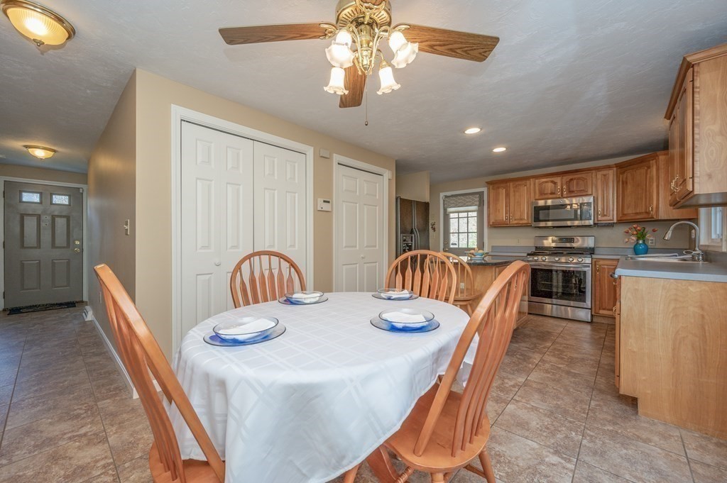 85 Elyse Road Mansfield, MA 02048 - Photo 11 of 30 a view of a dining room with furniture