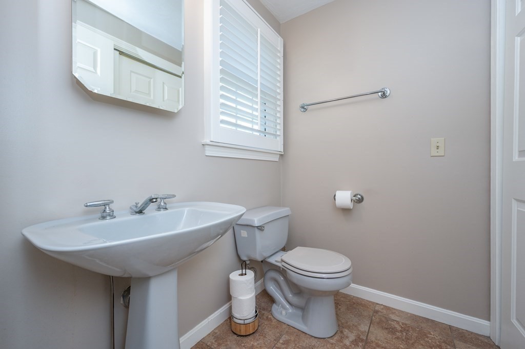 85 Elyse Road Mansfield, MA 02048 - Photo 13 of 30 a bathroom with a toilet sink and mirror