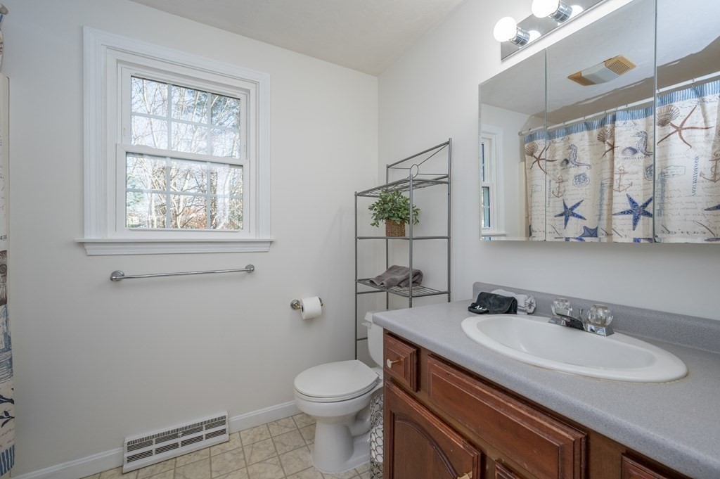 85 Elyse Road Mansfield, MA 02048 - Photo 20 of 30 a bathroom with a granite countertop sink toilet and mirror