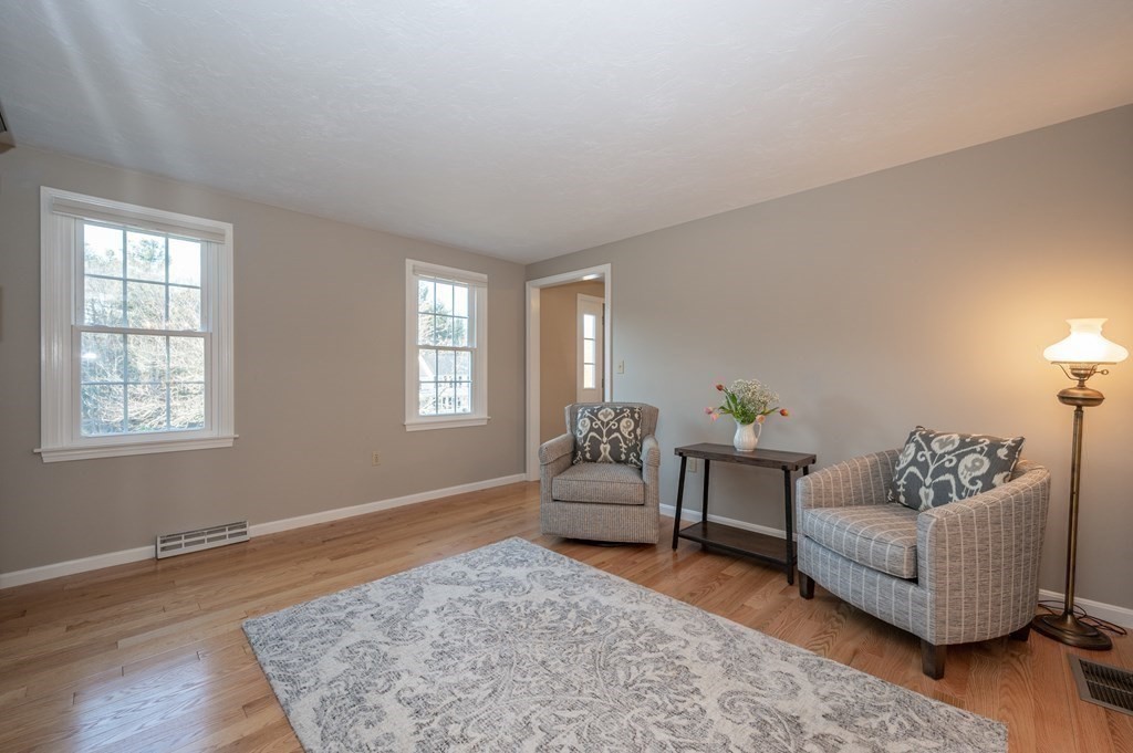 85 Elyse Road Mansfield, MA 02048 - Photo 7 of 30 a living room with furniture and a rug