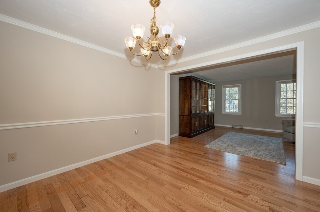 85 Elyse Road Mansfield, MA 02048 - Photo 9 of 30 wooden floor in an empty room with a window