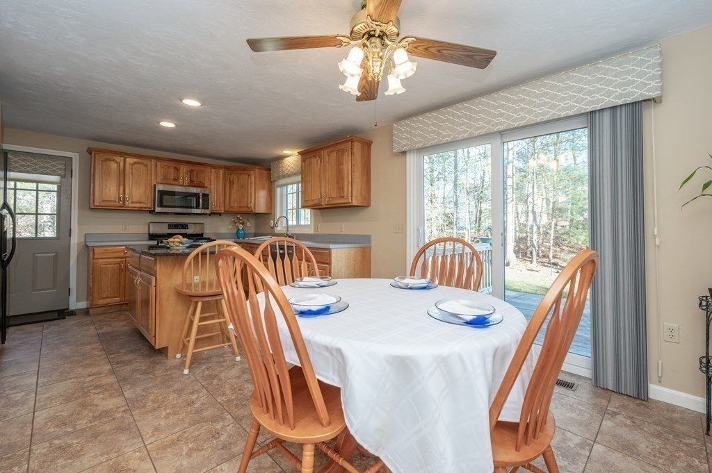 85 Elyse Road Mansfield, MA 02048 - Photo 10 of 30 a view of a dining room with furniture window and outside view