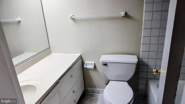 a bathroom with a toilet and a sink