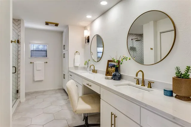 a bathroom with a double vanity sink and a mirror