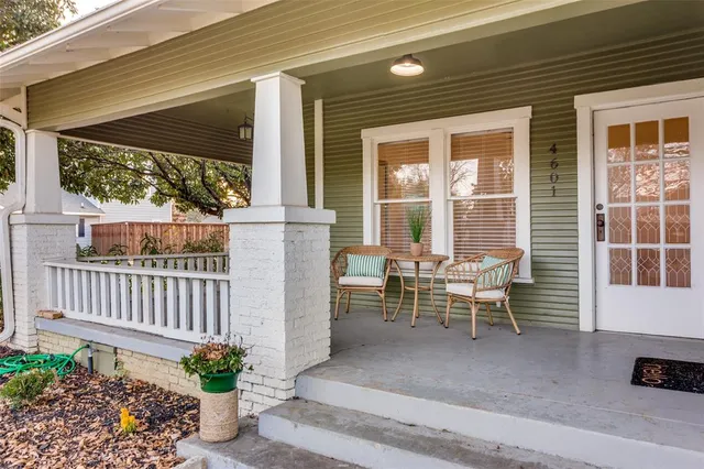 a view of a patio with table and chairs and potted plants