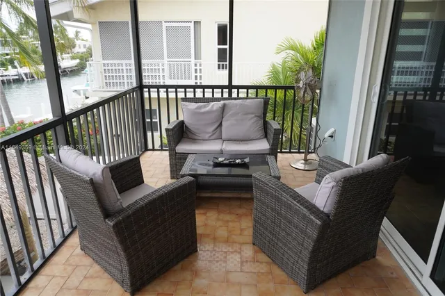 a view of kitchen with furniture and flat screen tv