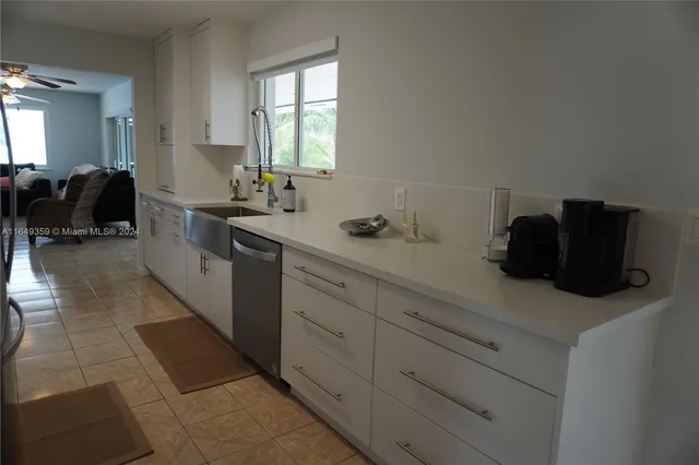a kitchen that has a stove and a table