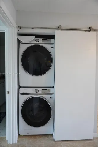 a bathroom with a toilet sink vanity and mirror
