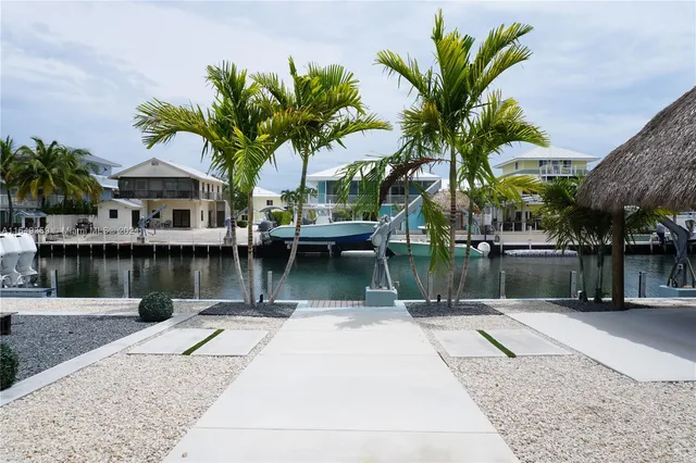 a swimming pool with outdoor seating and yard