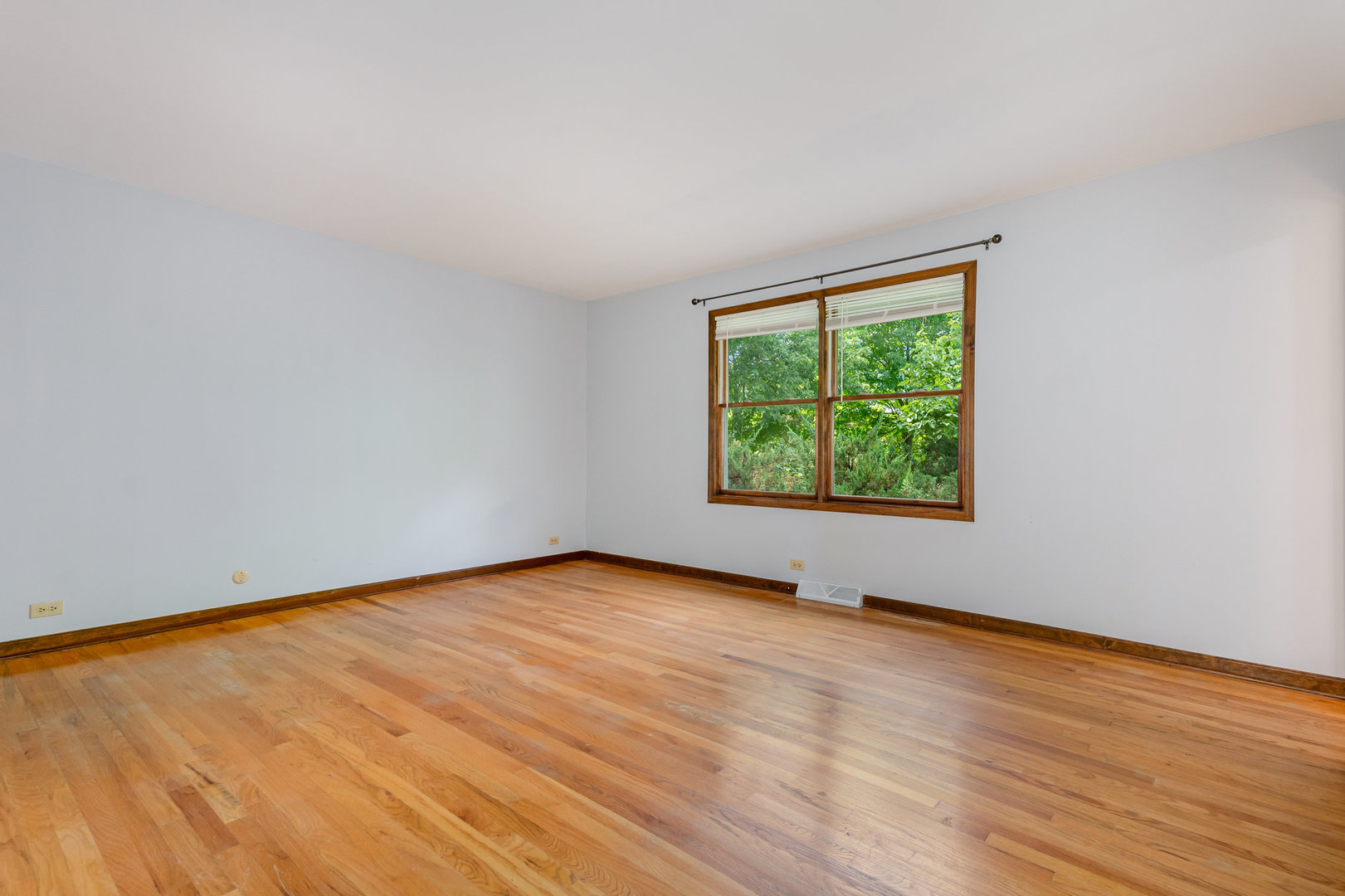 158 South Ela Road Barrington, IL 60010 - Photo 10 of 21 a view of an empty room with wooden floor and a window
