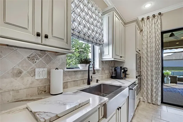 a bathroom with a granite countertop sink a toilet and bathtub