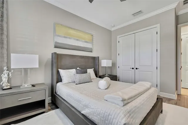 a living room with furniture a large window and gym equipment