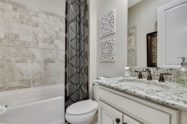 a view of a workspace with furniture and a book shelf