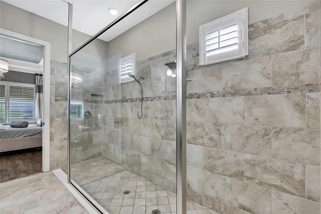 a view of a patio with table and chairs and potted plants