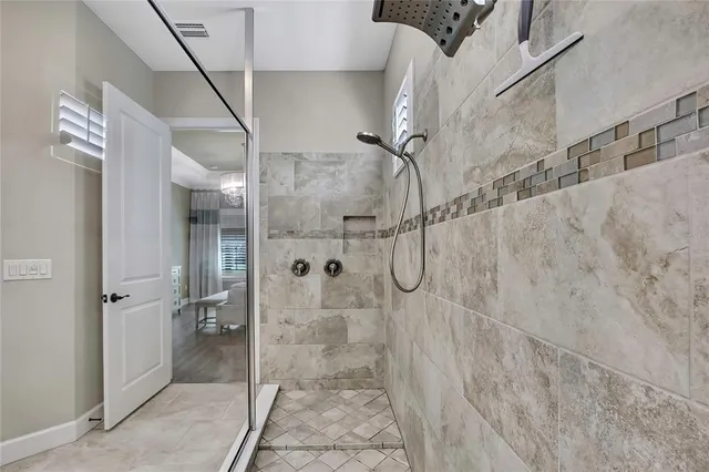 a view of a backyard with swimming pool