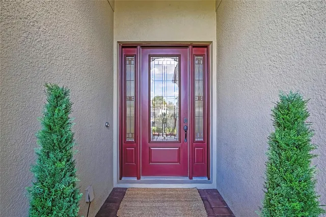a living room with furniture and a view of kitchen