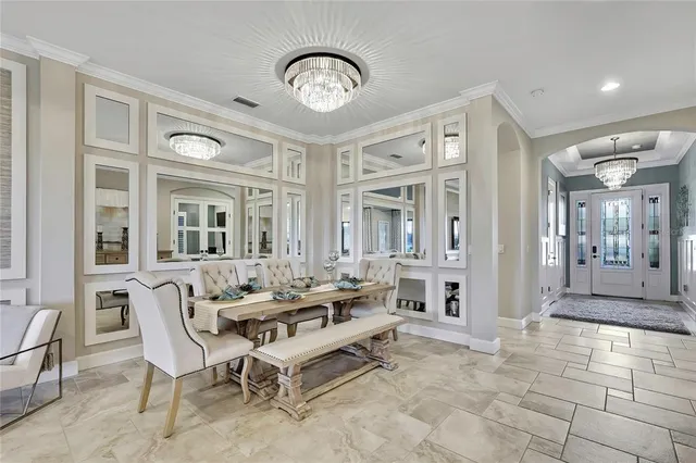 a kitchen with granite countertop a stove and a white cabinets