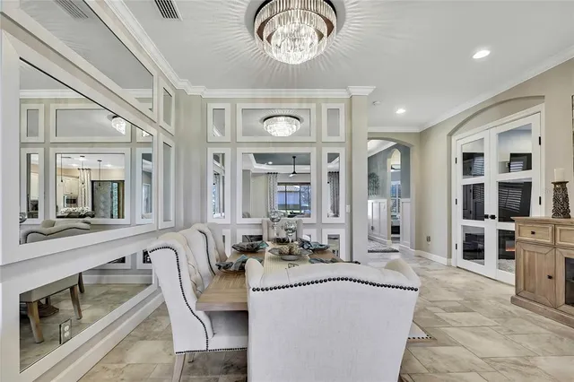 a kitchen with stainless steel appliances granite countertop a sink refrigerator and cabinets