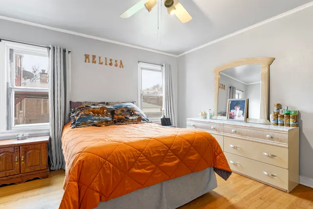 a bedroom with a bed and a dresser