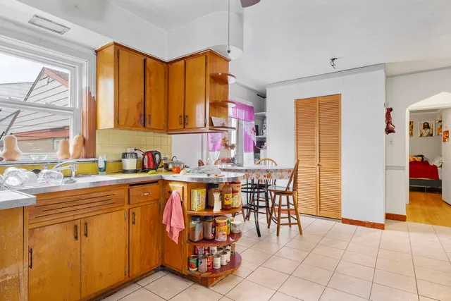 a kitchen with a sink and cabinets