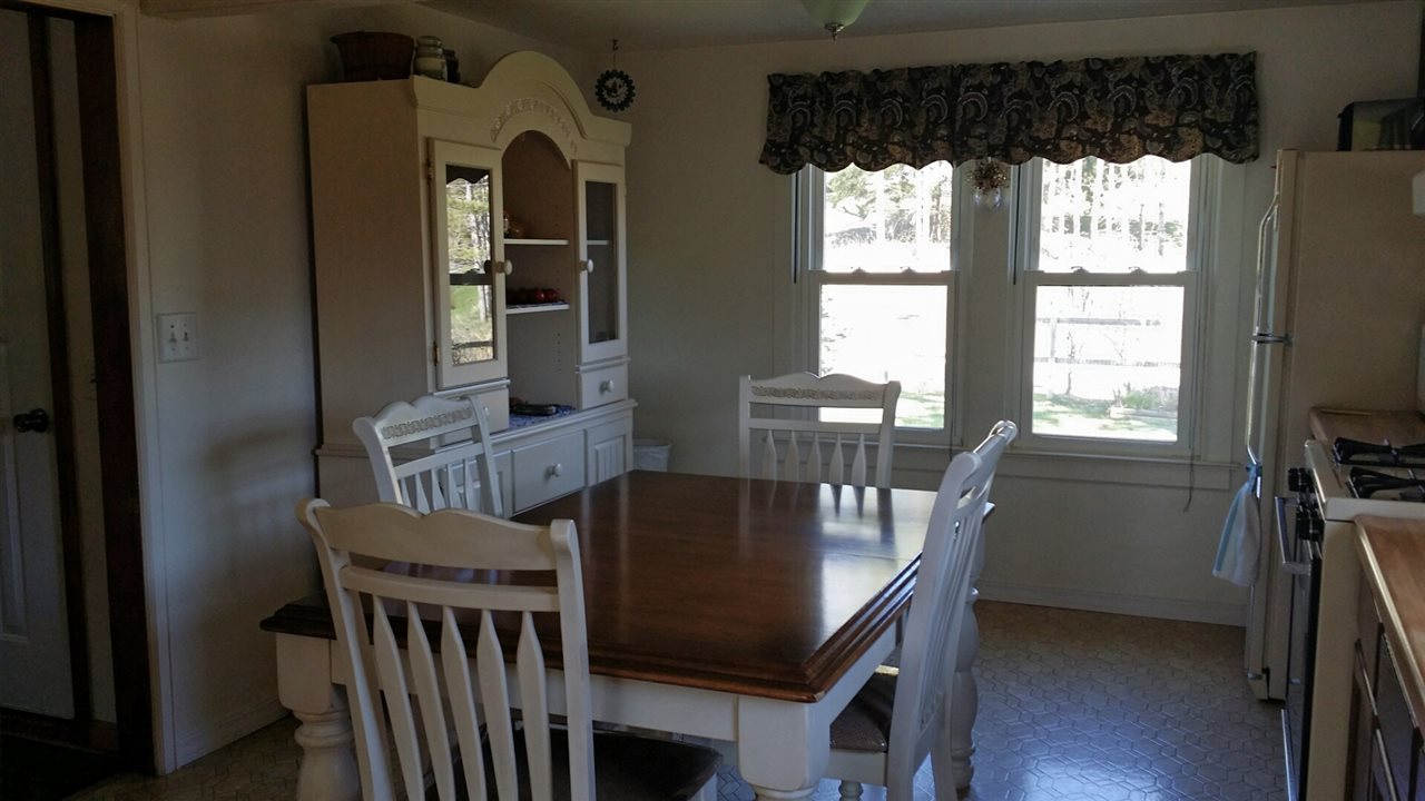 1714 North River Road Oregon, IL 61061 - Photo 5 of 8 a view of a dining room with furniture and window