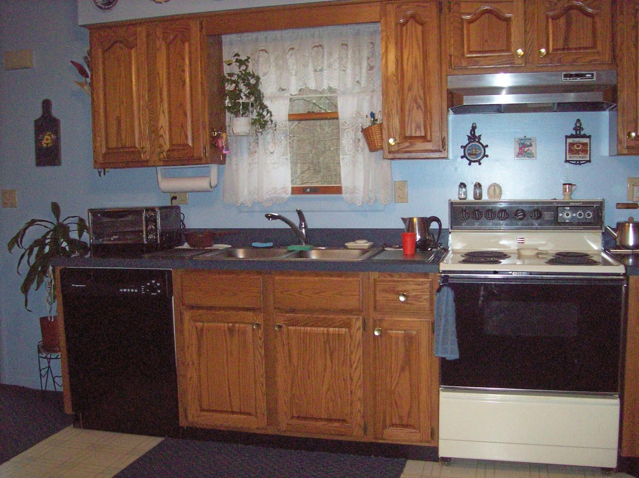 606 Frailey Road Stroudsburg, PA 18360 - Photo 10 of 11 a kitchen with stainless steel appliances granite countertop a stove a sink and a microwave