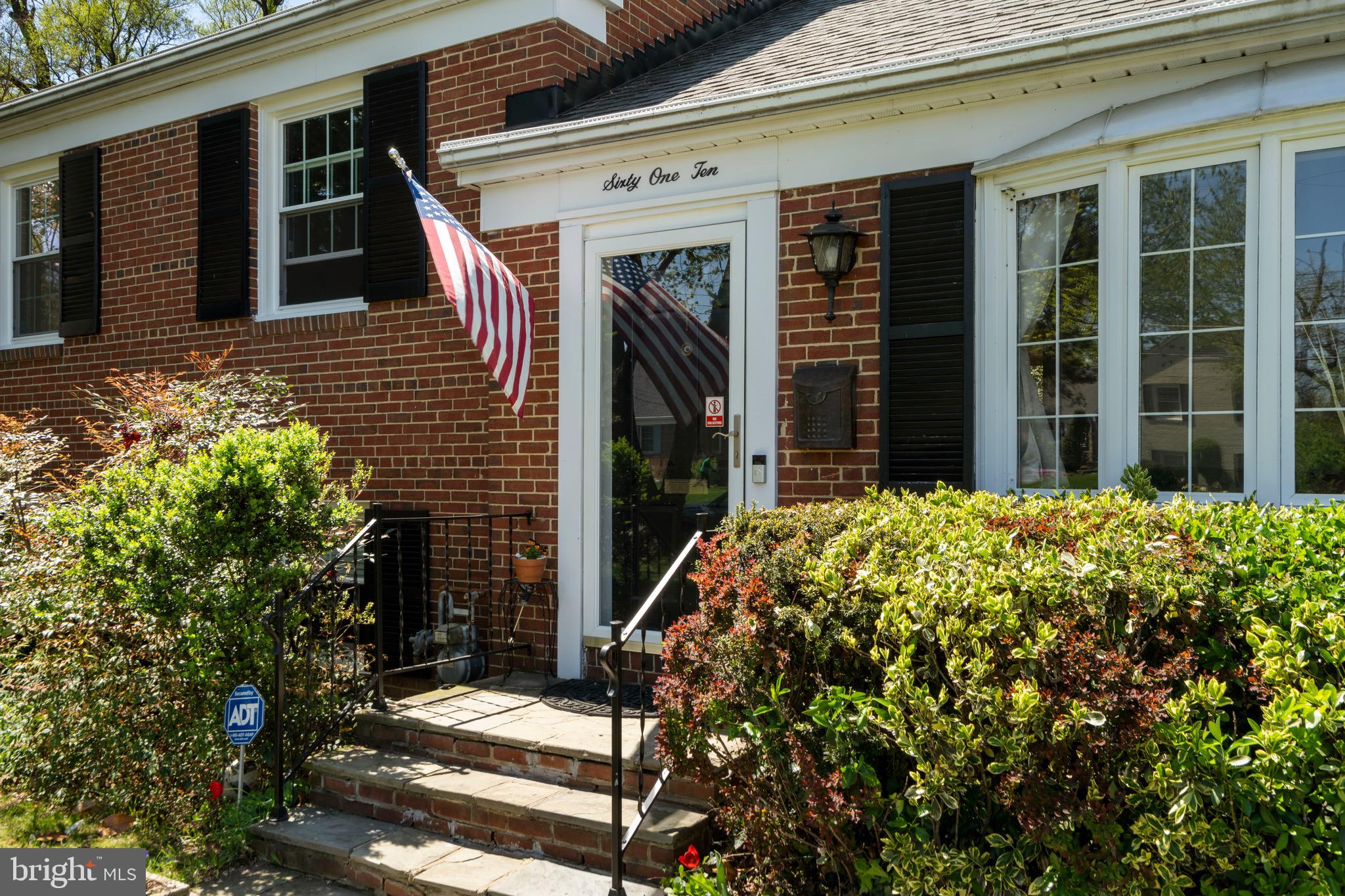 6110 Dorchester Street Springfield, VA 22150 - Photo 1 of 38 a front view of a house with a garden