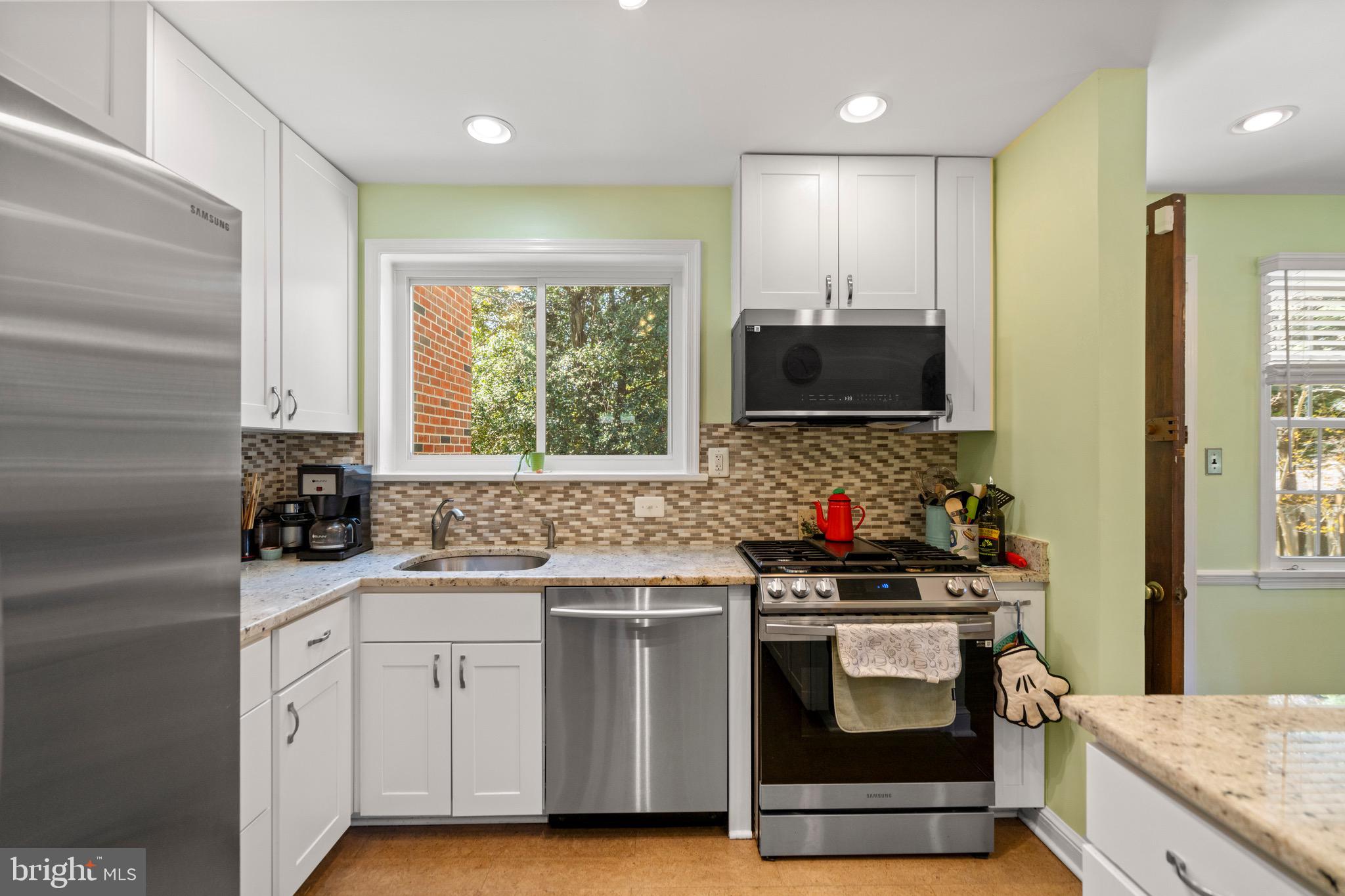 6110 Dorchester Street Springfield, VA 22150 - Photo 19 of 38 a kitchen with a stove and a sink