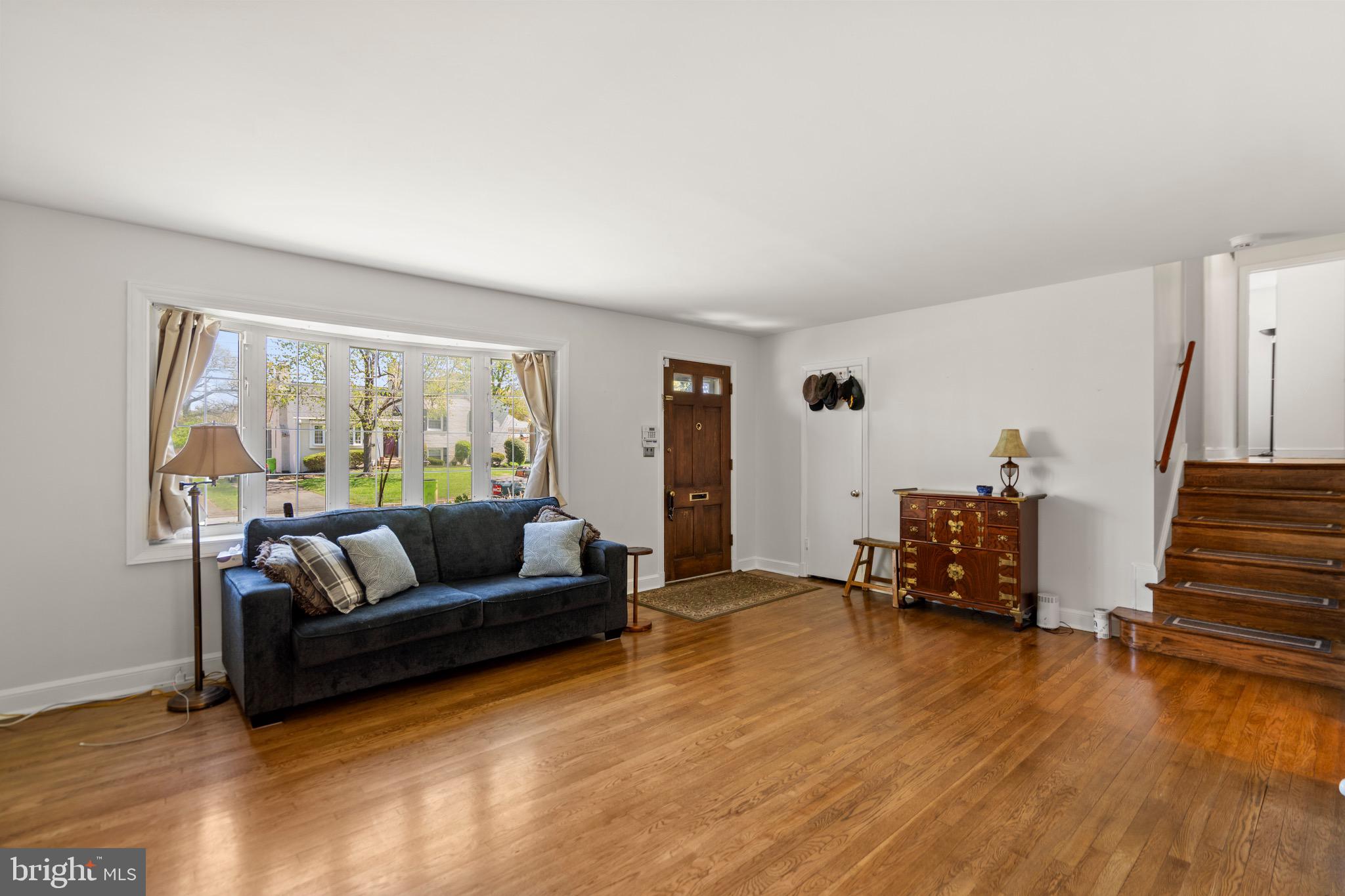 6110 Dorchester Street Springfield, VA 22150 - Photo 25 of 38 a living room with furniture and a wooden floor