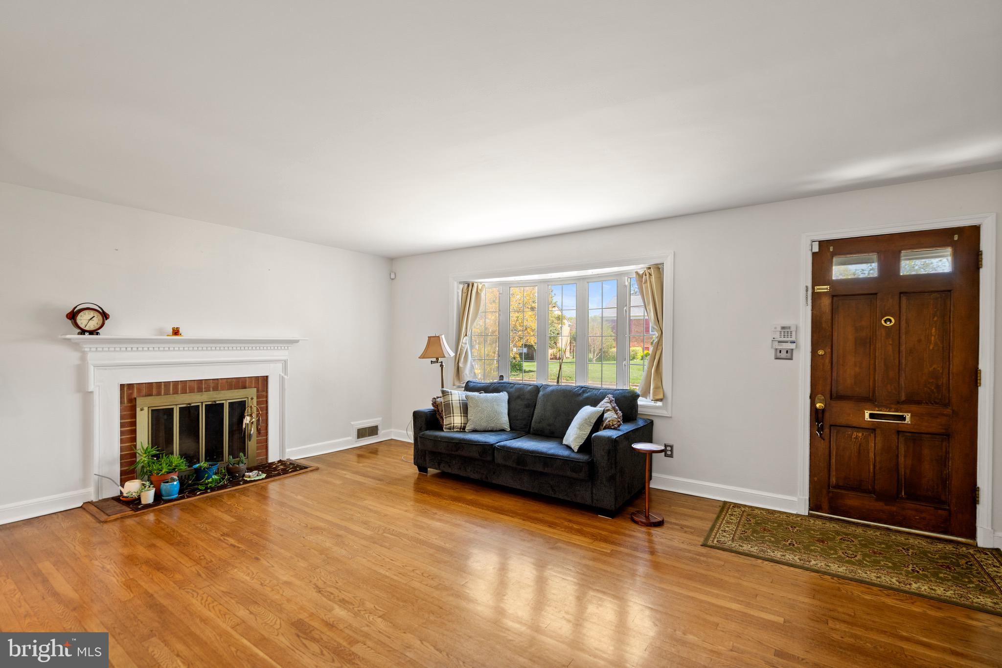 6110 Dorchester Street Springfield, VA 22150 - Photo 26 of 38 a living room with furniture and a fireplace