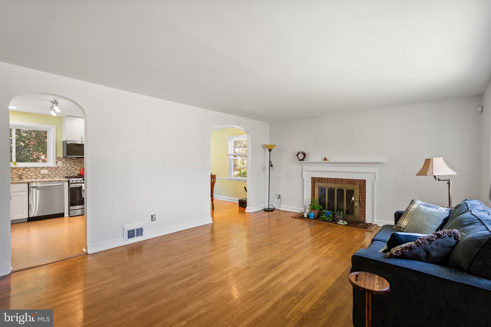 6110 Dorchester Street Springfield, VA 22150 - Photo 27 of 38 a living room with furniture and a fireplace