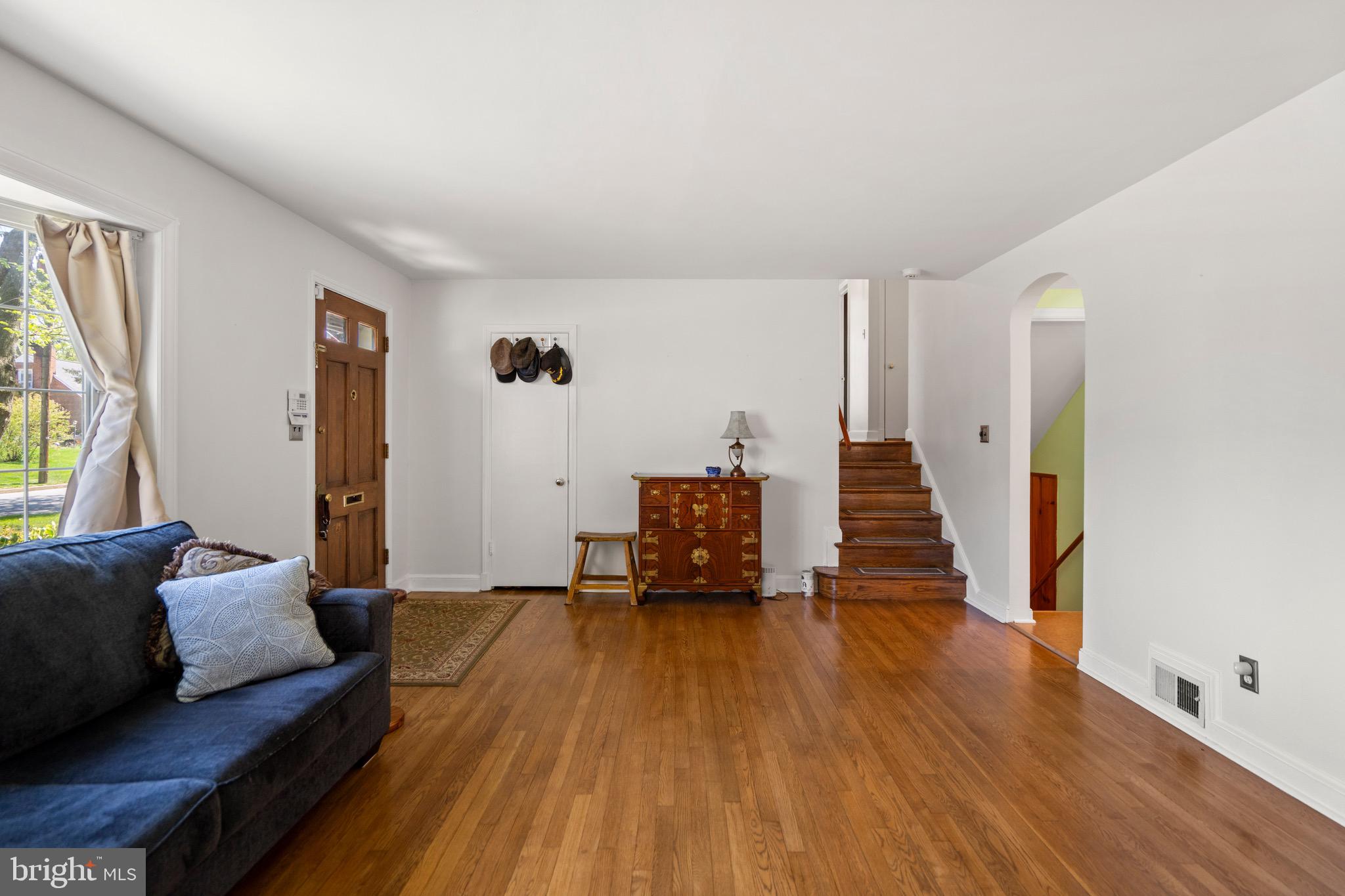 6110 Dorchester Street Springfield, VA 22150 - Photo 29 of 38 a living room with furniture and a wooden floor
