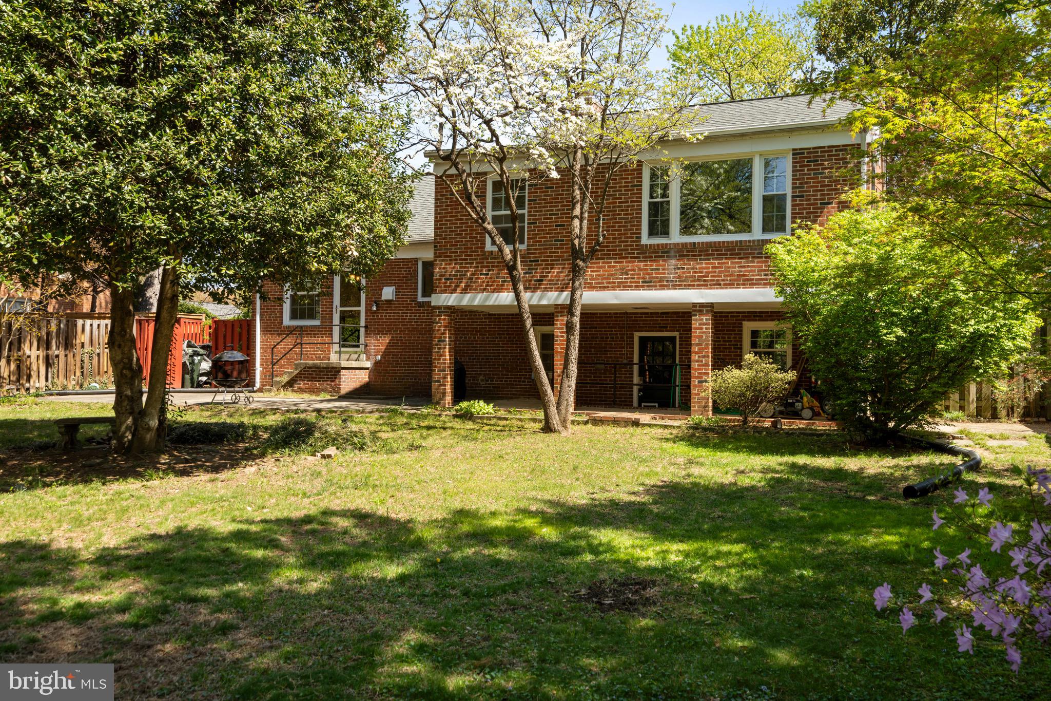 6110 Dorchester Street Springfield, VA 22150 - Photo 33 of 38 a front view of a house with a yard