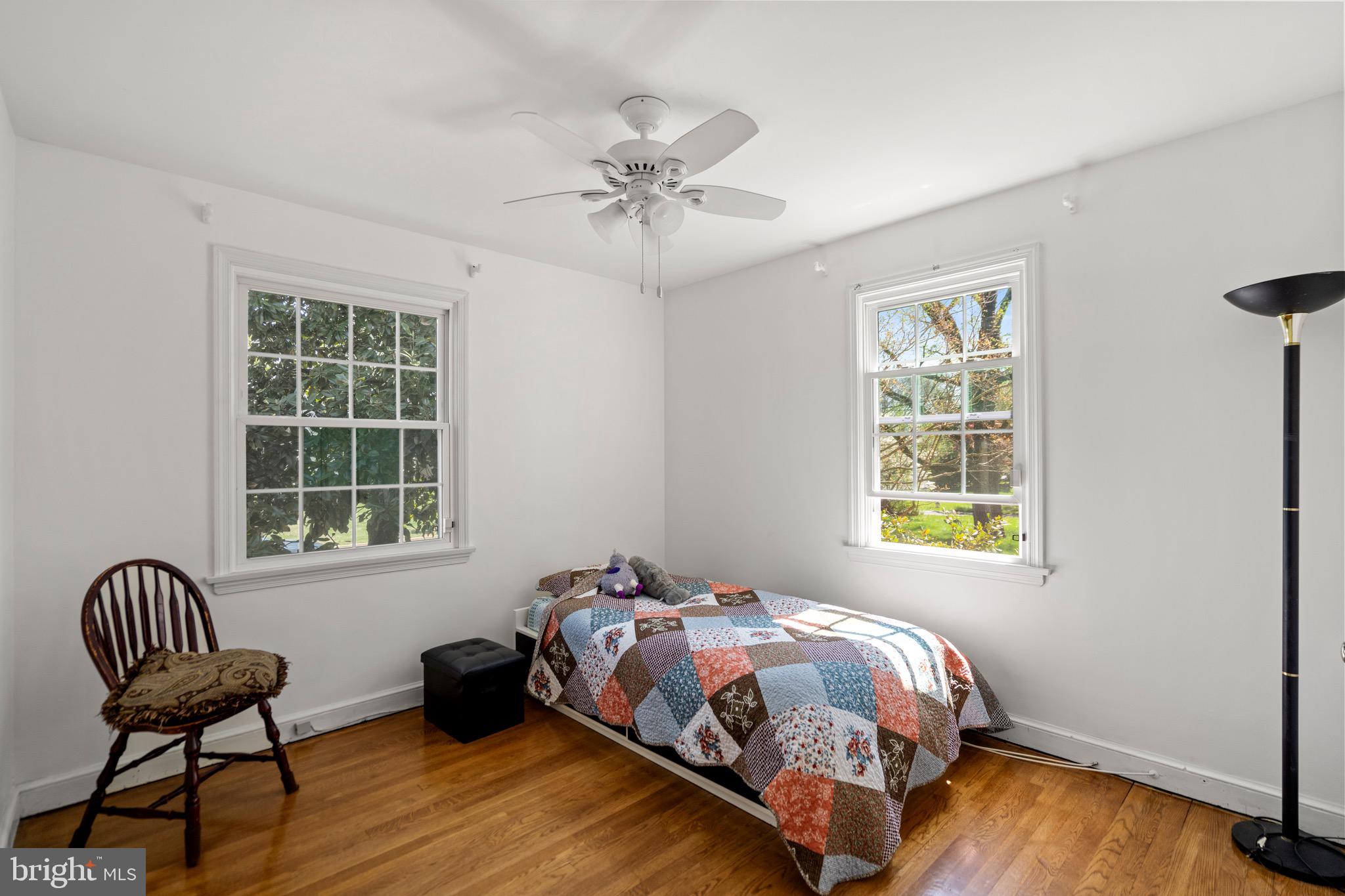 6110 Dorchester Street Springfield, VA 22150 - Photo 4 of 38 a bedroom with a bed and a window