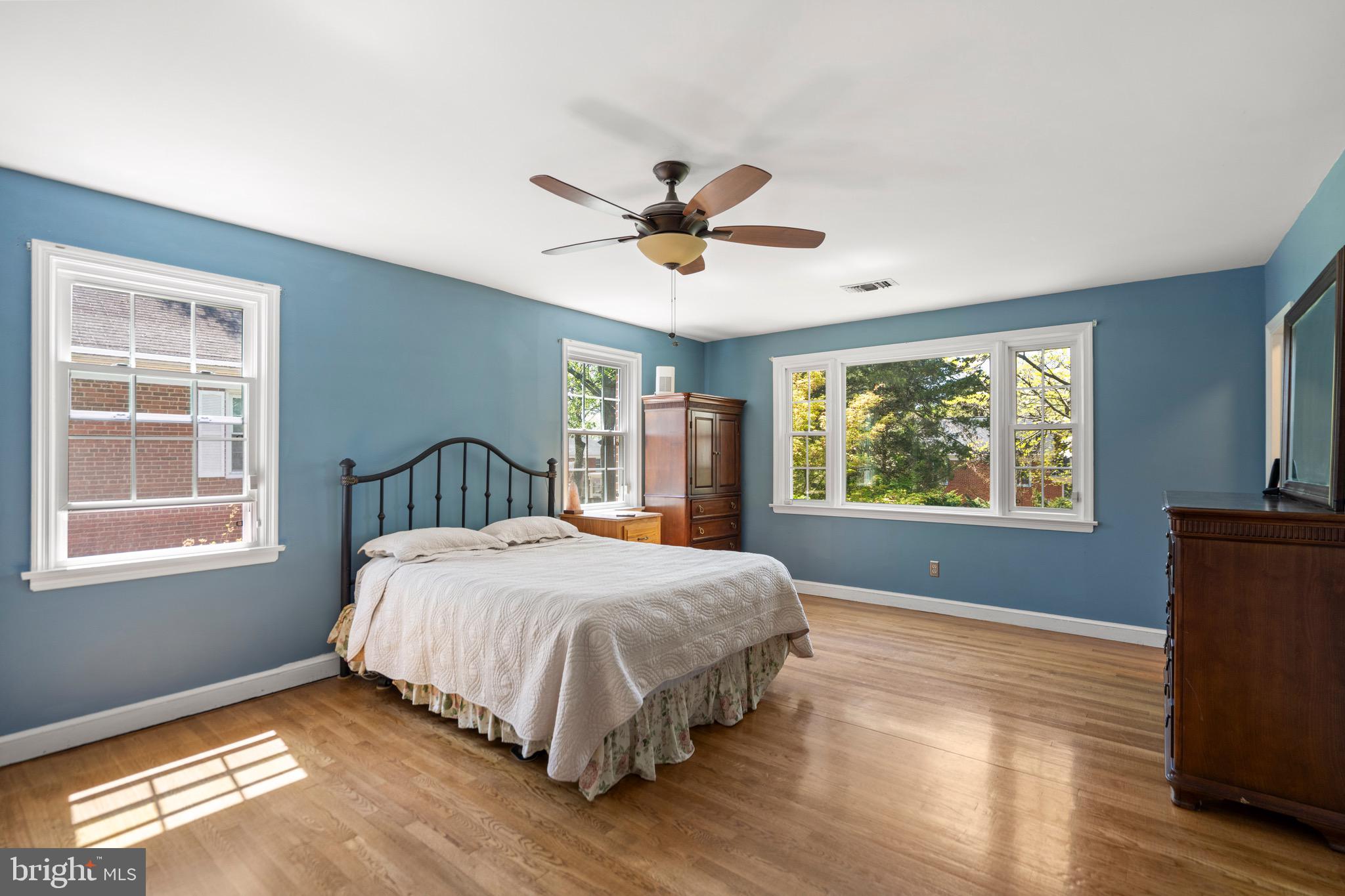 6110 Dorchester Street Springfield, VA 22150 - Photo 5 of 38 a bedroom with a bed and a window