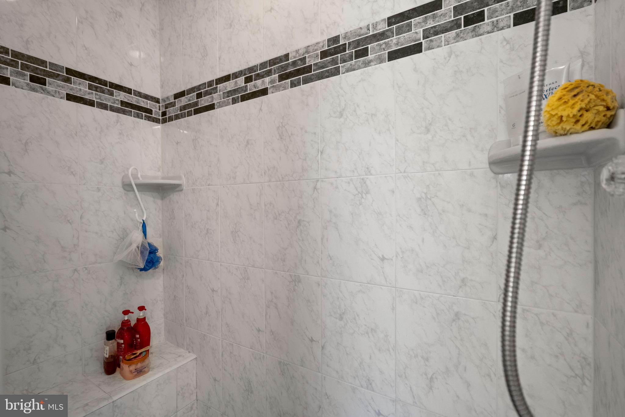 6110 Dorchester Street Springfield, VA 22150 - Photo 9 of 38 a bathroom with a shower and a shower