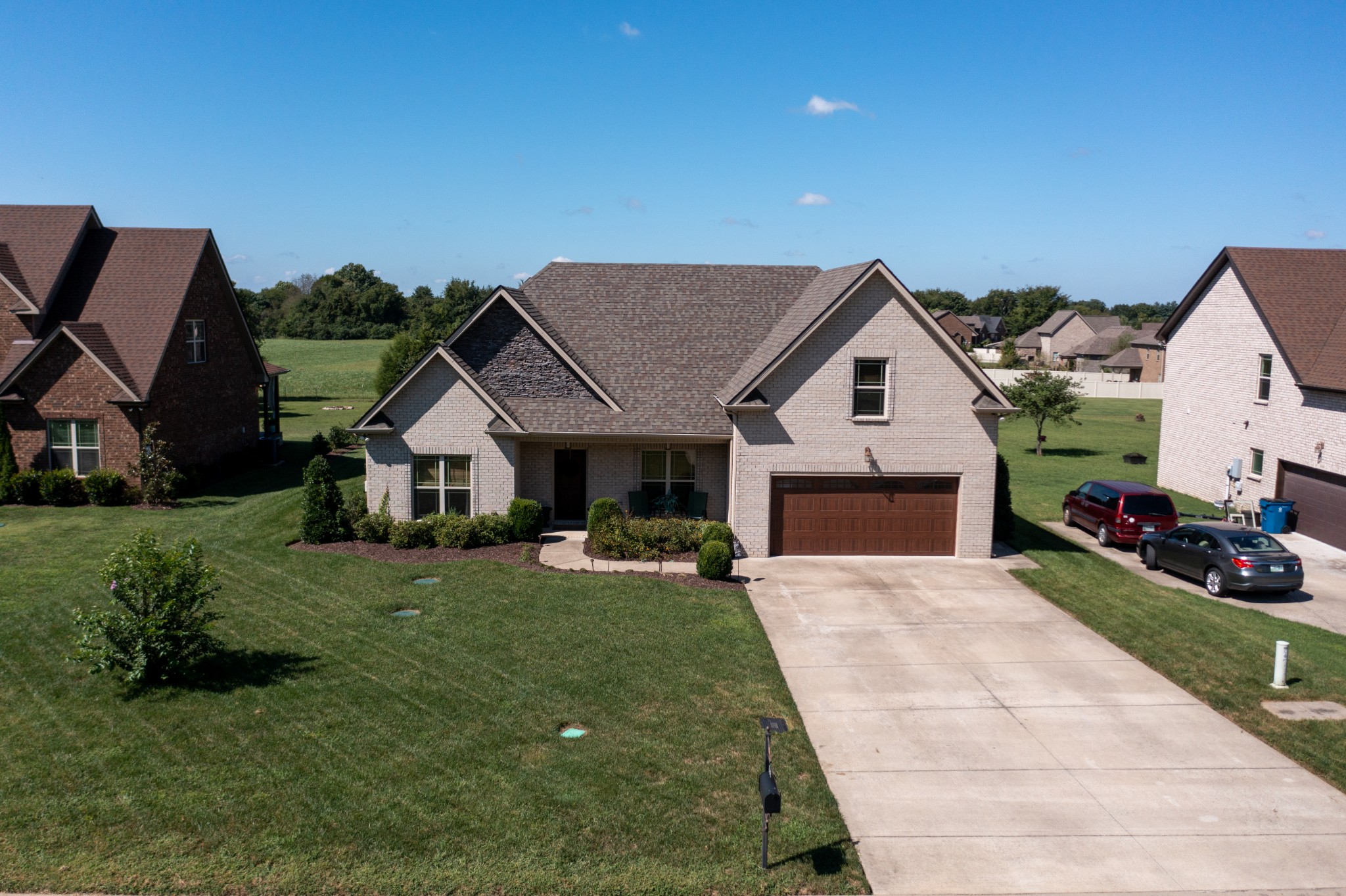 308 Amazonway Ridge Lascassas, TN 37085 - Photo 2 of 23 a front view of a house with a yard and garage