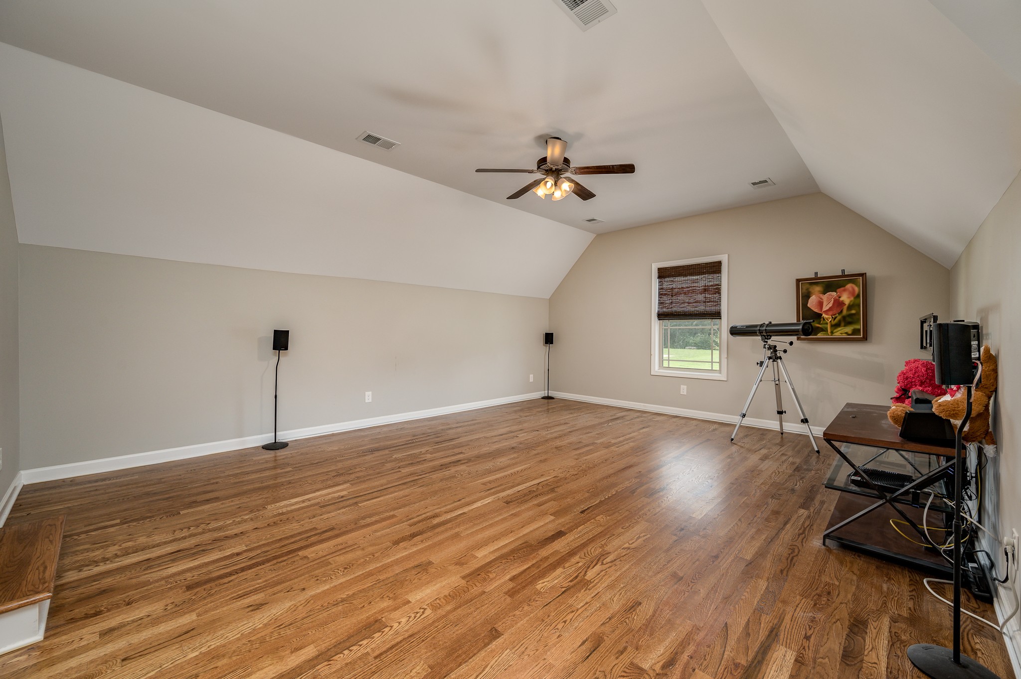 308 Amazonway Ridge Lascassas, TN 37085 - Photo 17 of 23 a view of a room with wooden floor and ceiling fan