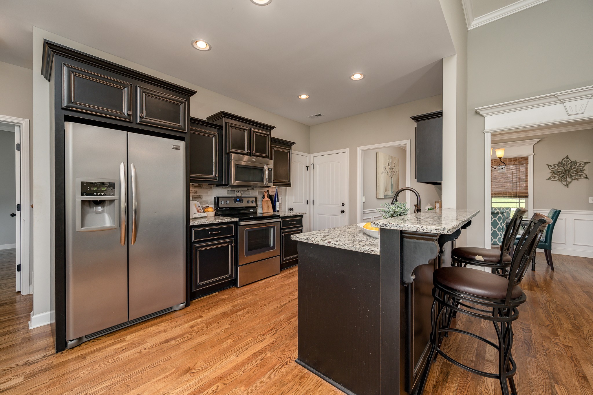 308 Amazonway Ridge Lascassas, TN 37085 - Photo 7 of 23 a kitchen with stainless steel appliances granite countertop a refrigerator stove microwave and sink
