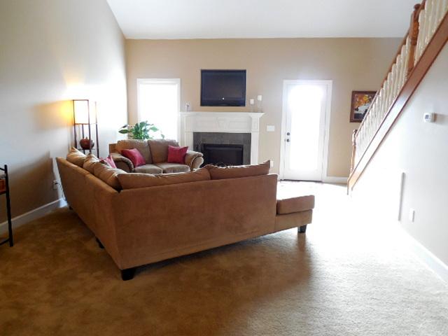 414 Conquest Road Murfreesboro, TN 37128 - Photo 2 of 18 Spacious Great Room with Hardwood Flooring, Vaulted Ceiling and Electric Fireplace to Take the Chill Off the Cold Winter Nights!